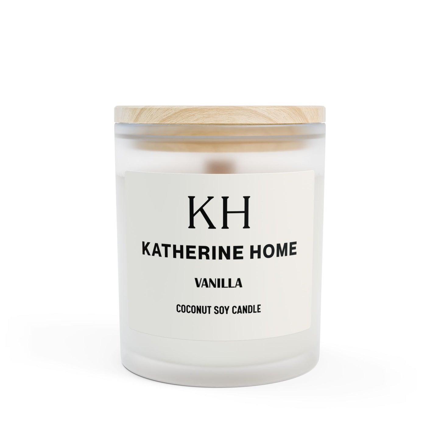 Vanilla-scented coconut soy candle in a frosted glass jar with a wooden lid by Katherine Home.