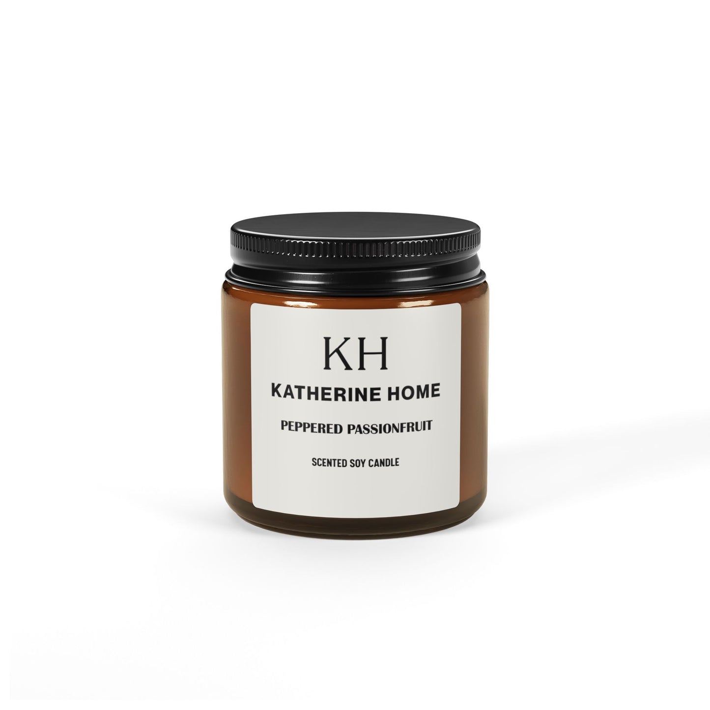 Peppered Passionfruit 4oz Amber Soy Candle by Katherine Home, featuring notes of mango, coconut, and citrus in a sleek amber jar.