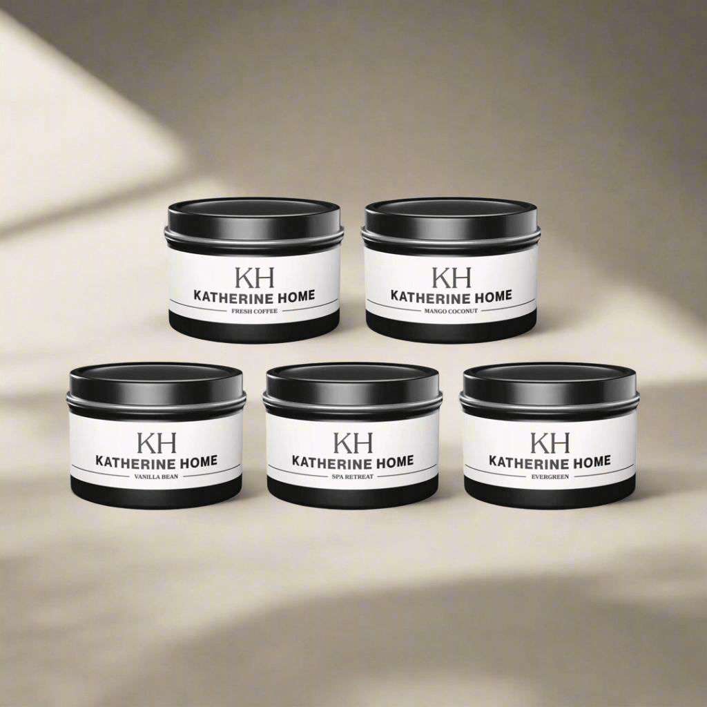 Travel candle set with five scents in 4oz tins, including Fresh Coffee and Mango Coconut by Katherine Home.