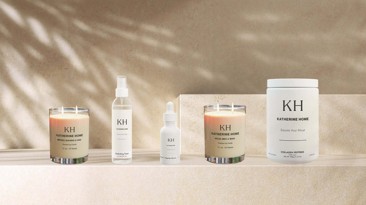 A curated selection of Katherine Home candles, skincare, and supplements displayed together in a luxury lifestyle setting.