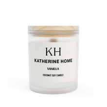 Vanilla-scented coconut soy candle in a frosted glass jar with a wooden lid by Katherine Home.