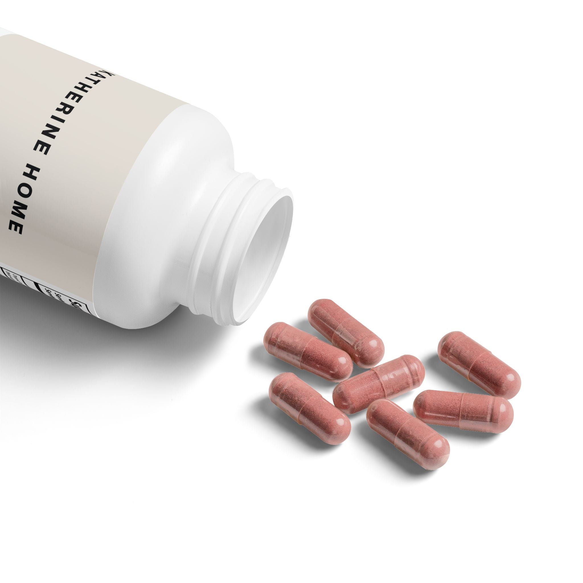 White supplement bottle with pink capsules on a white background
