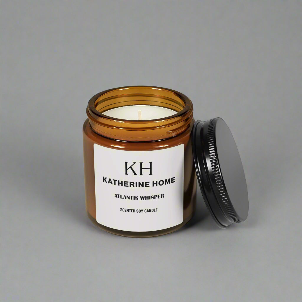 Atlantis Whisper 4oz Candle with notes of soft dark musk, ocean breeze, and sandalwood in an amber jar with lid open.
