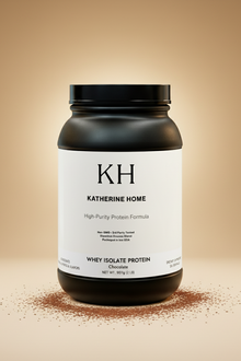 Black container of Katherine Home whey isolate protein on a beige background