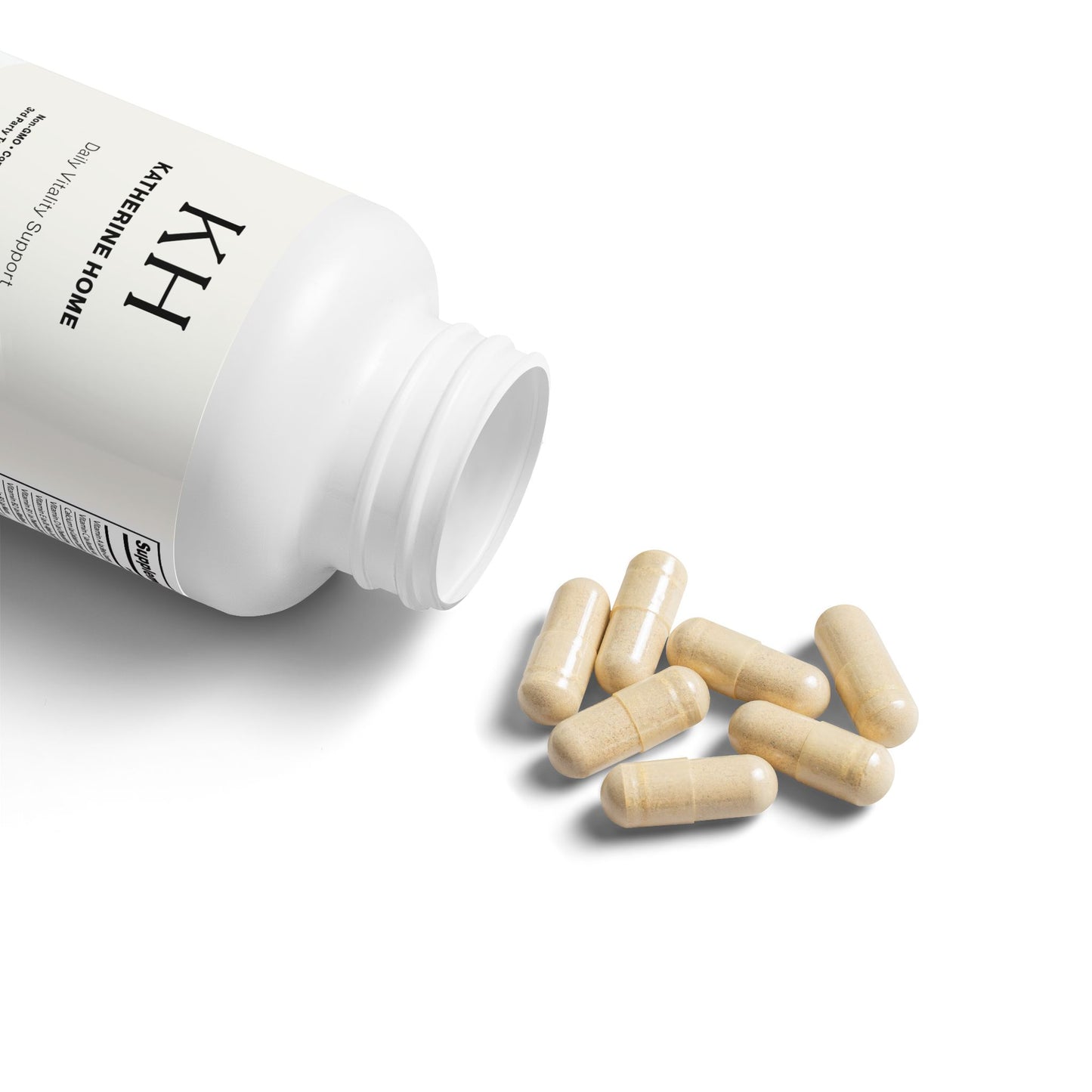 Open KH Multivitamin for Men bottle with beige capsules spilling out on a white surface.