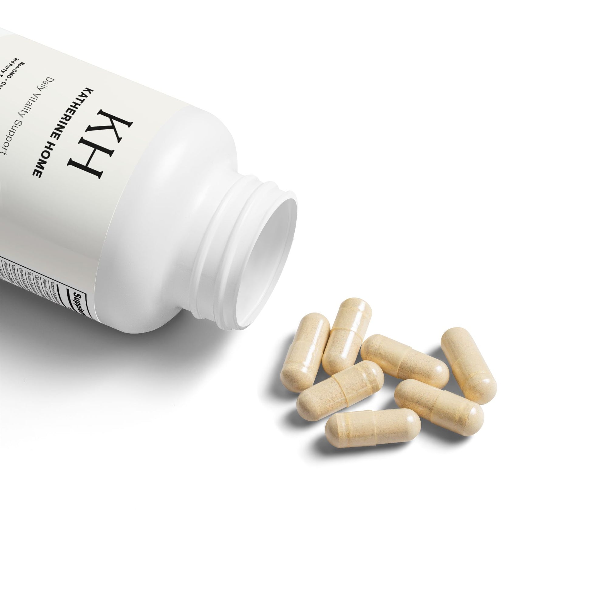 Open KH Multivitamin for Men bottle with beige capsules spilling out on a white surface.