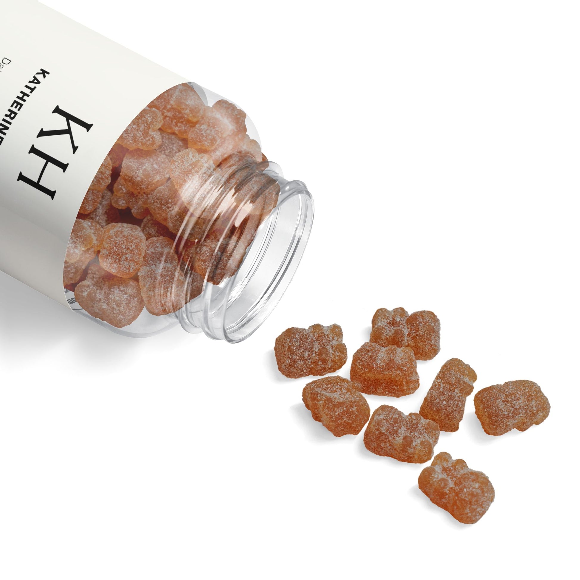 Open bottle of Katherine Home Multivitamin Gummies with colorful strawberry gummies spilling beside it.