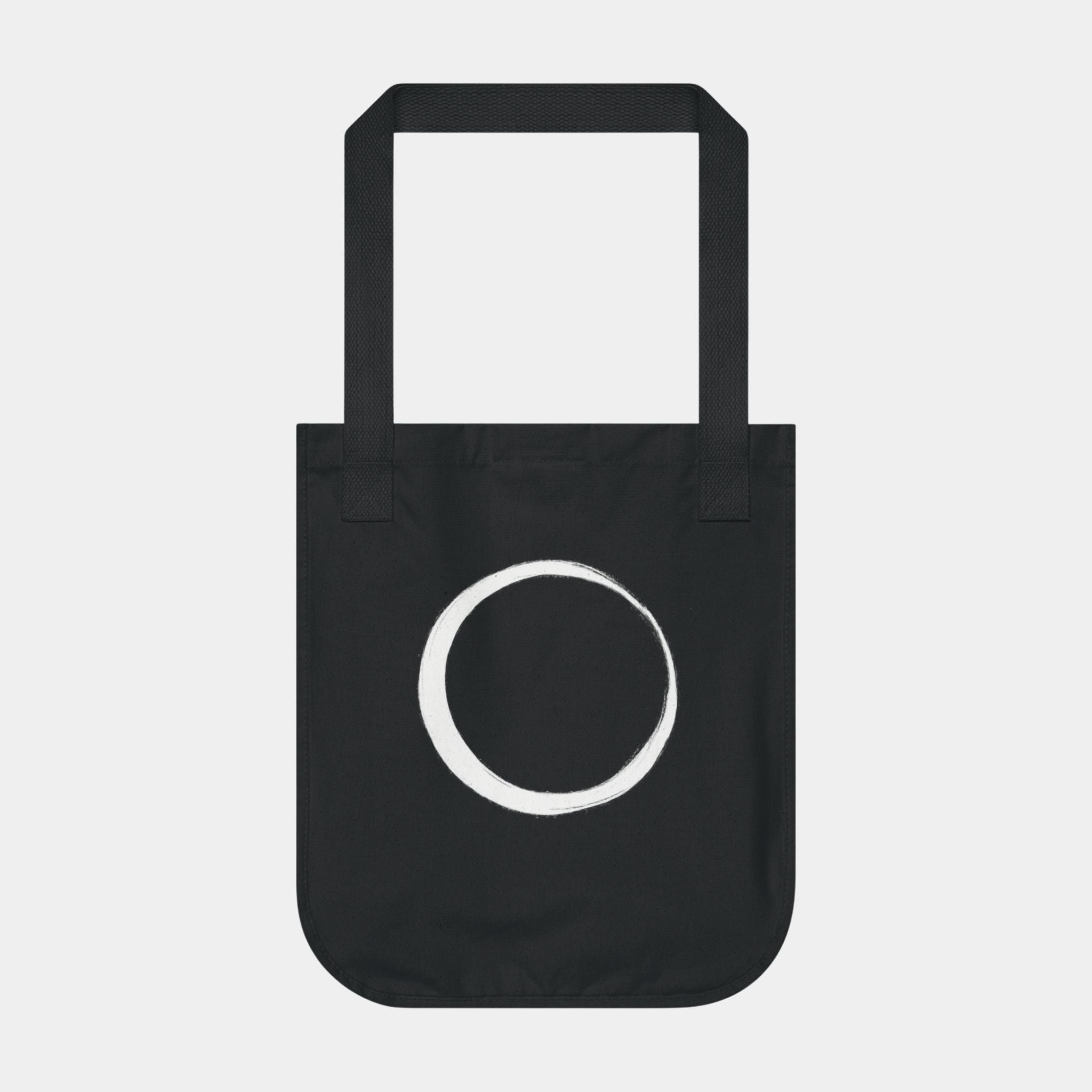 Black canvas tote with white circle print and two handles