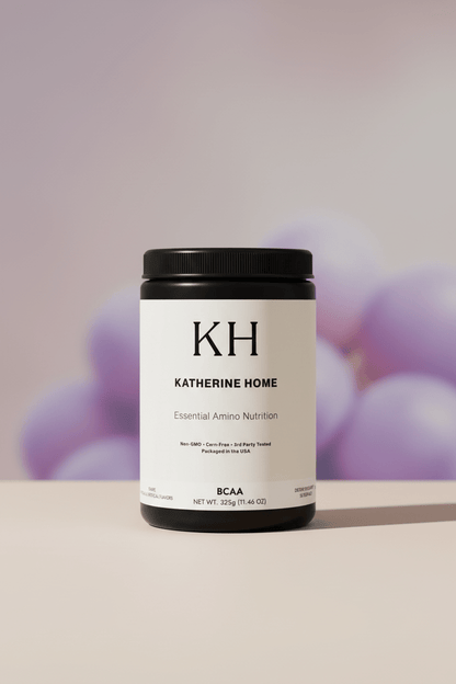 BCAA Supplement, Grape - KATHERINE HOMEFood SupplementsKATHERINE HOMEKATHERINE HOMEKatherine Home BCAA Grape supplement set against a soft grape - toned background, creating a refined and calming flavor - inspired lifestyle image.