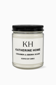 Cinnamon & Brown Sugar - KATHERINE HOMEHome DecorKATHERINE HOMEKATHERINE HOMEKatherine Home Cinnamon & Brown Sugar scented soy candle in a clear glass jar, minimalist product hero image.Amber Jar + Black Lid4oz