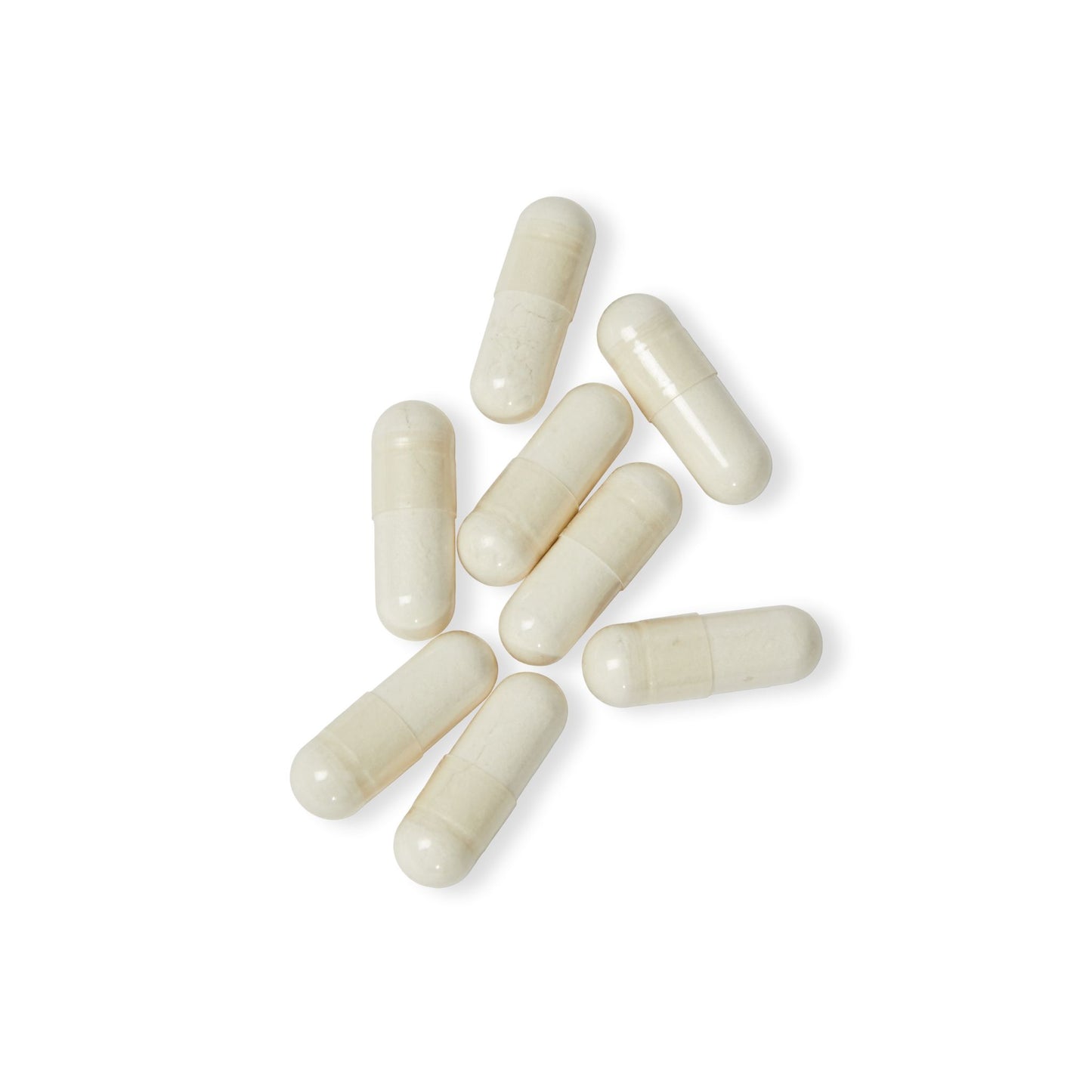 Close-up flat lay of Katherine Home 5-HTP capsules on a white surface, highlighting their smooth capsule form.