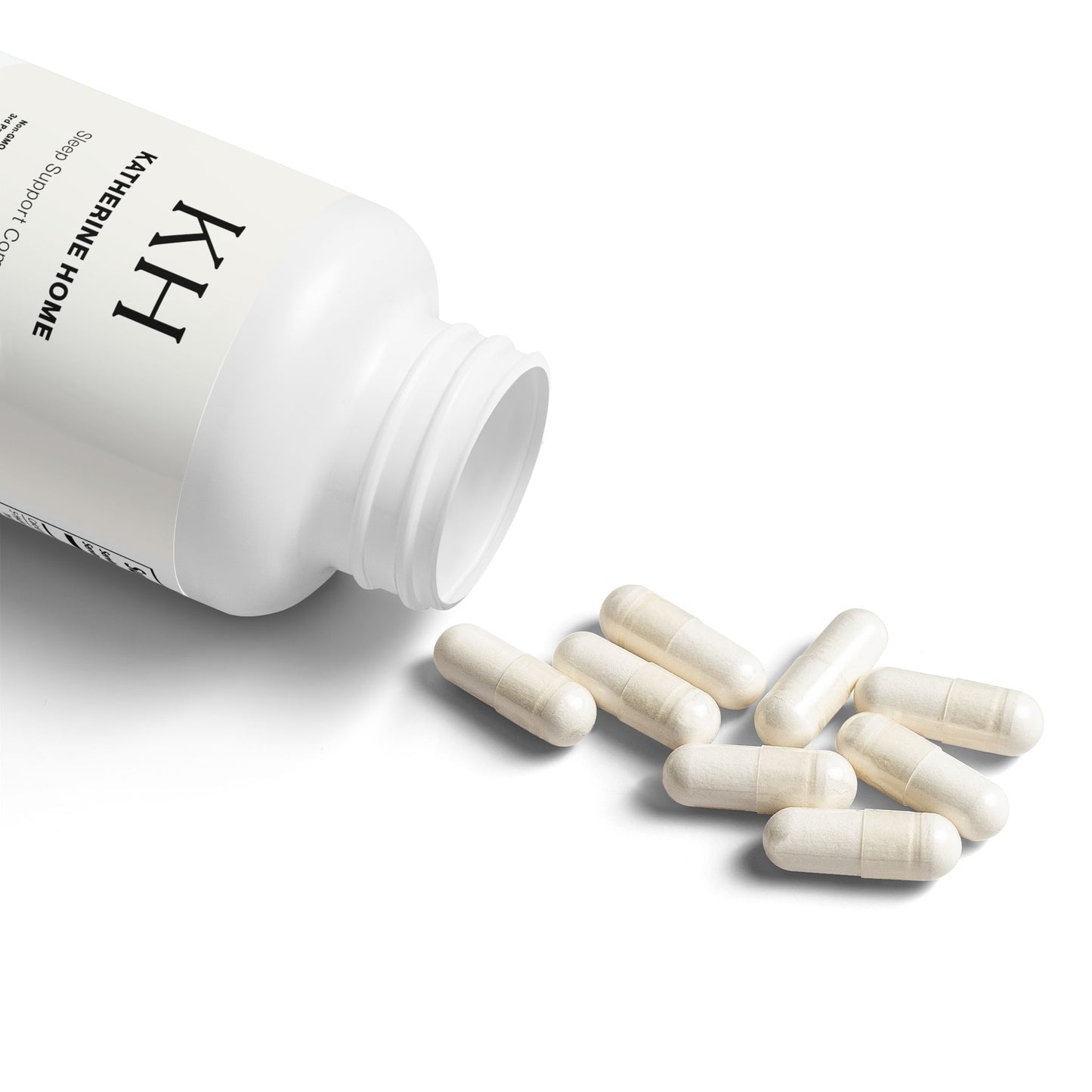 Open bottle of Katherine Home 5-HTP Supplement with white capsules spilling onto a clean background.