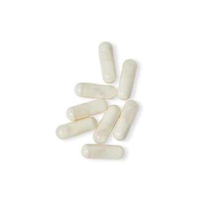 Close-up of Digestive Enzyme Blend capsules displayed on white background.