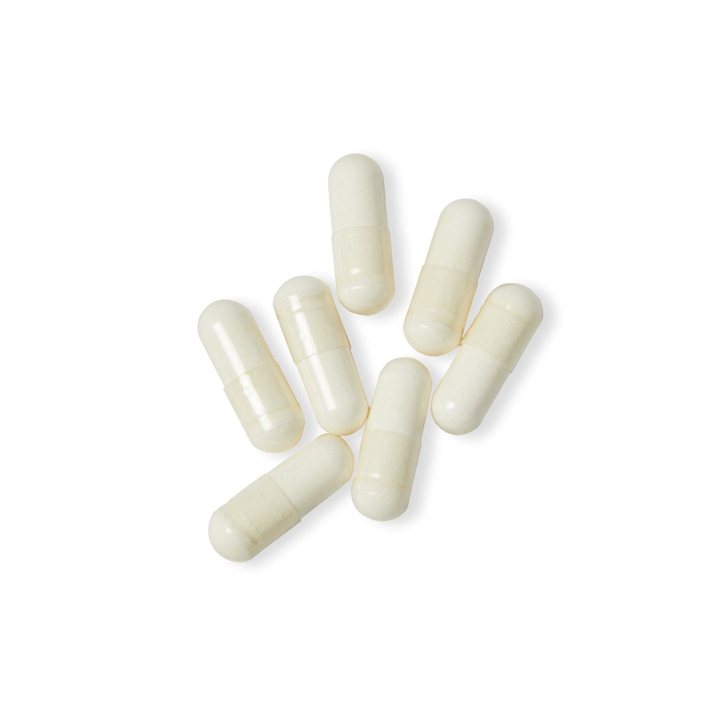 Close-up of Katherine Home L-Arginine vegetable capsules arranged neatly on a white surface.