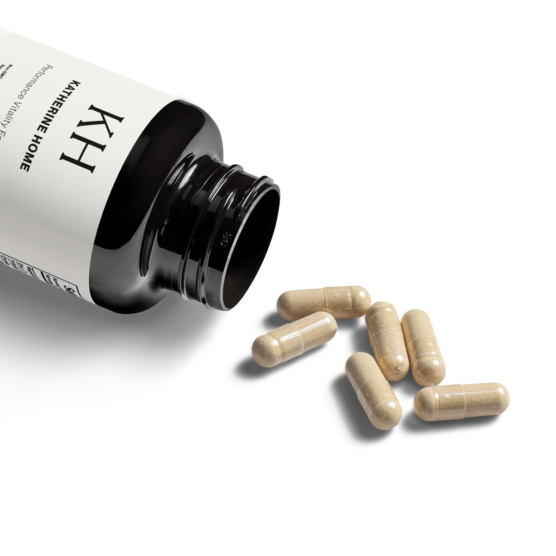 Open bottle of Katherine Home Magnesium Zinc Supplement showing vegetable capsules and matte black container.
