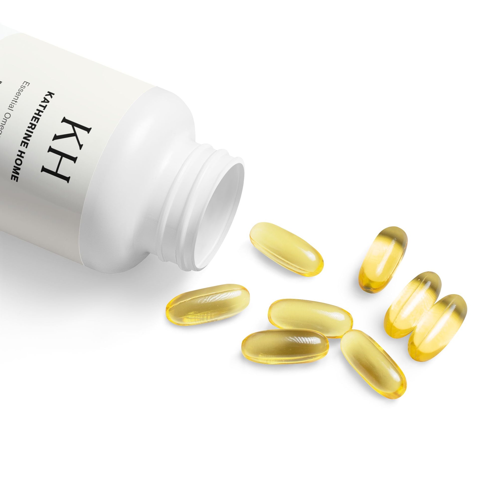 Katherine Home Omega 3 Fish Oil bottle open with softgels spilling gently onto a white surface.