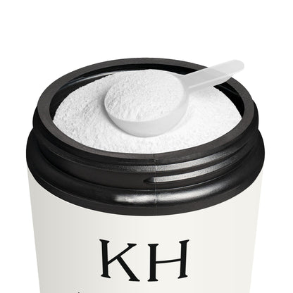 Open jar of Katherine Home Pre-Workout Supplement showing powder texture and scoop inside the matte black container.
