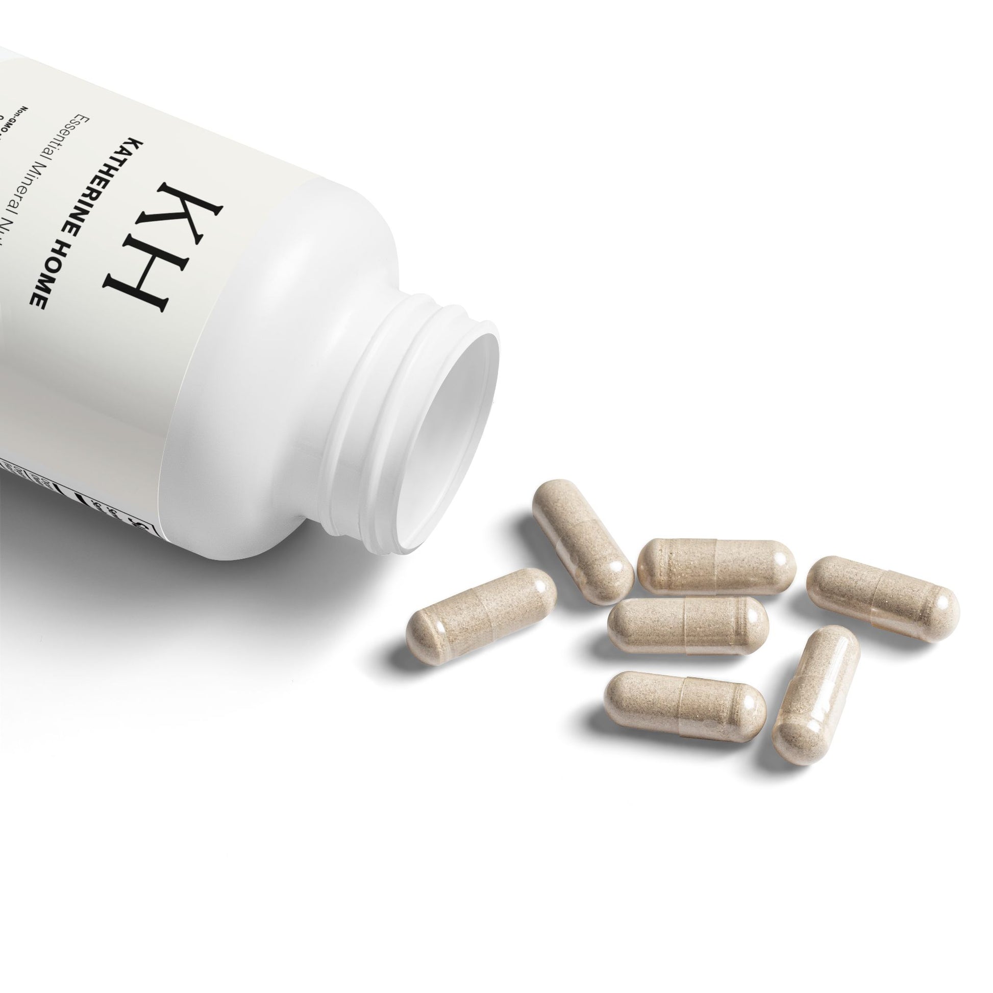 Katherine Home Sea Moss Supplement bottle open with capsules gently spilling onto a white surface.