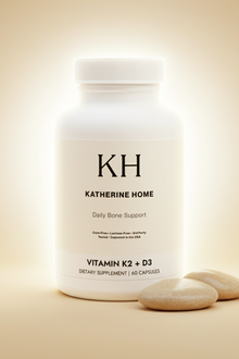 Supplement container labeled 'Katherine Home' with two capsules on a beige background