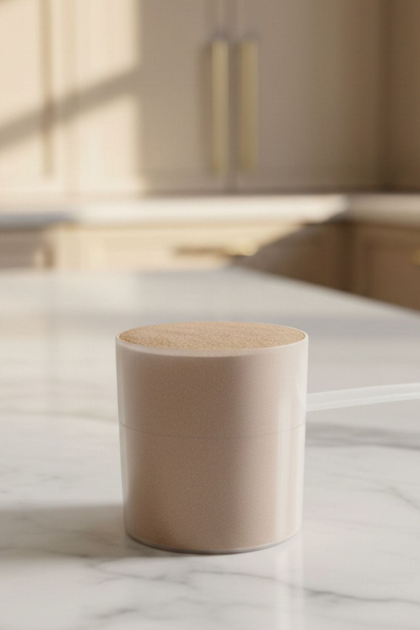 Whey Isolate Protein Supplement (Chocolate) by KATHERINE HOME powder texture in a scoop