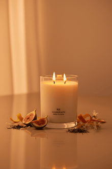 White Tea & Fig candle styled in a warm neutral setting.